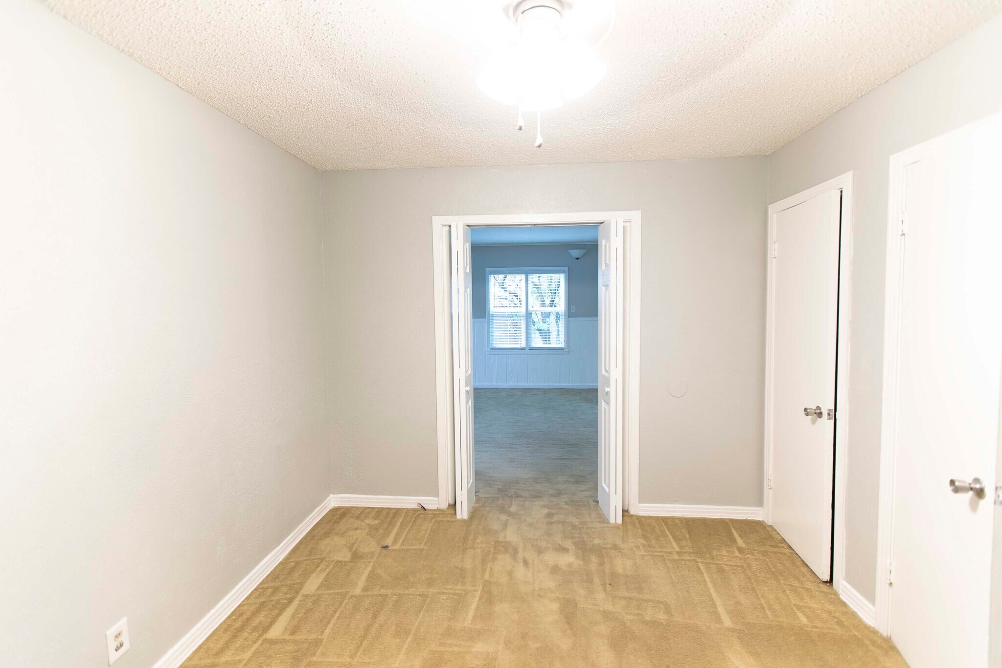 Bedroom 1 looking into living area 2 - 7459 Mohawk Ave