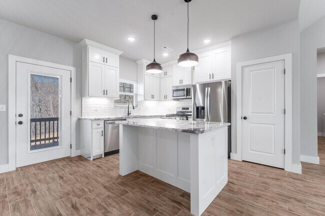 Building Photo - Welcome to this stunning 3-bedroom, 2-bathroom home that boasts a range of high-quality features ...