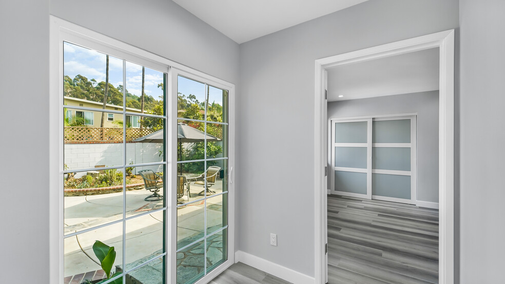 Hallway to Backyard and Primary Ensuite - 5902 Blairstone Dr