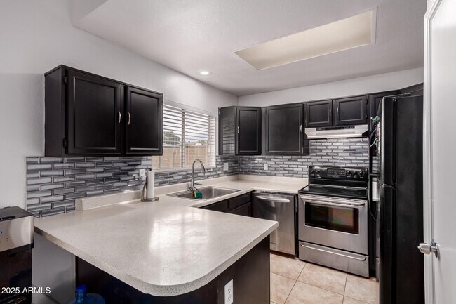 Building Photo - 6038 W Gelding Dr