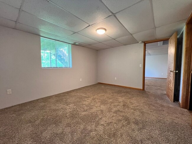 Building Photo - Spacious 3BR Duplex with Finished Basement & 2-Car Garage in Otsego