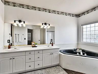 Building Photo - "Charming 4-Bed Oasis with Elegant Hardwoo...