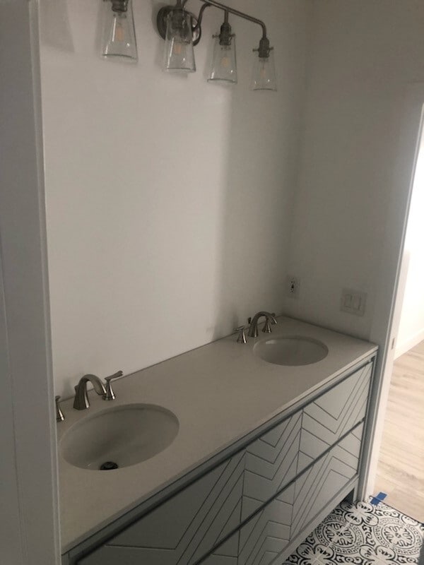 Shared bathroom (photo taken prior to mirror install, sorry!) - 1820 E Woodbury Rd.