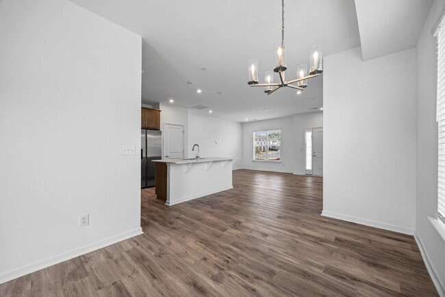 Building Photo - Spacious 3BR Townhome with Garage, Open Layout & Community Pool – Move-In Ready!