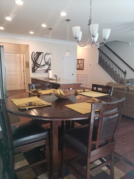 Dining Room area with a beautiful light fixture and shadow boxes - 263 COOLWATER LN