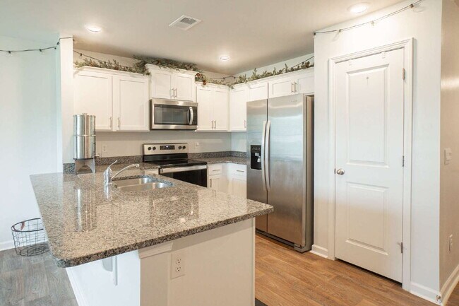 Building Photo - Partially furnished and now available!