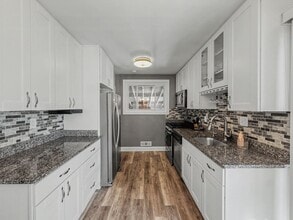 Building Photo - Furnished 4BD 2BA Home with Two kitchens, Basement, and Garage!