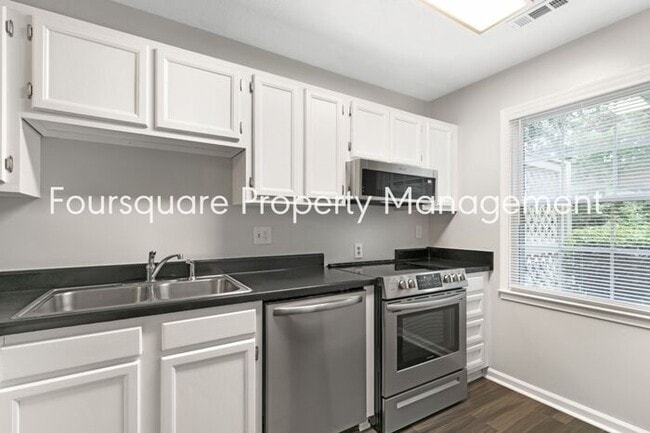Building Photo - Charming 1st-Floor End-Unit Condo with Gas Log Fireplace, Private Back Porch & Community Pool – T...