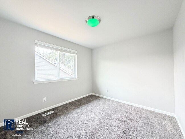 Building Photo - Easy JBLM Commute Like-New 4BR Home with 3-Car Garage & Bonus Office