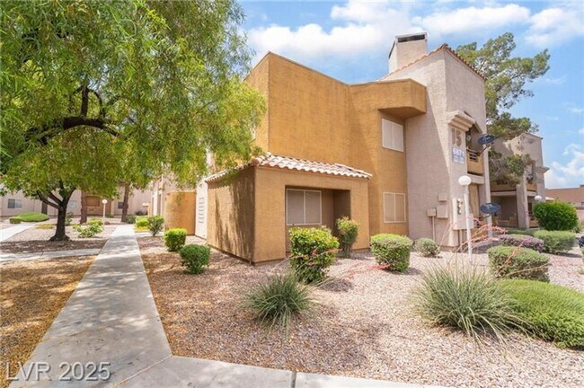 Building Photo - INVITING 2 BEDROOM TOP FLOOR CONDO IN A CE...