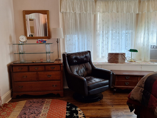 sitting area of bedroom - 4420 Troost Ave