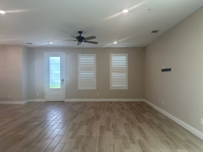 Building Photo - Modern home in a modern community featuring upgraded amities, solar, community pool + Close to Co...