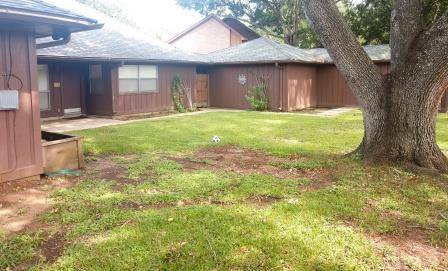 Back yard showing back of home and garage - 2518 Water Rest Dr