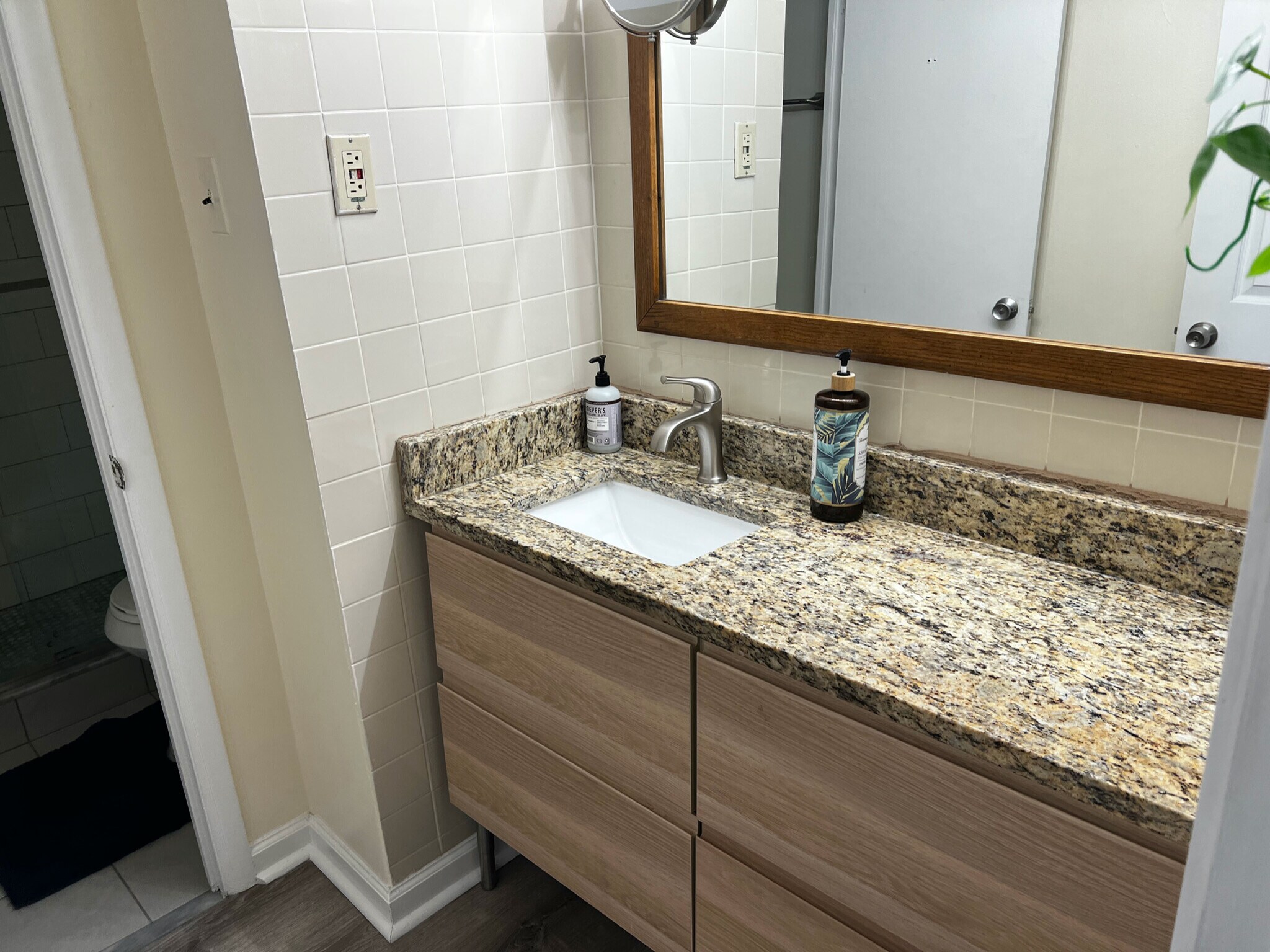 outer bathroom with sink, storage, granite counters - 1420 N St NW