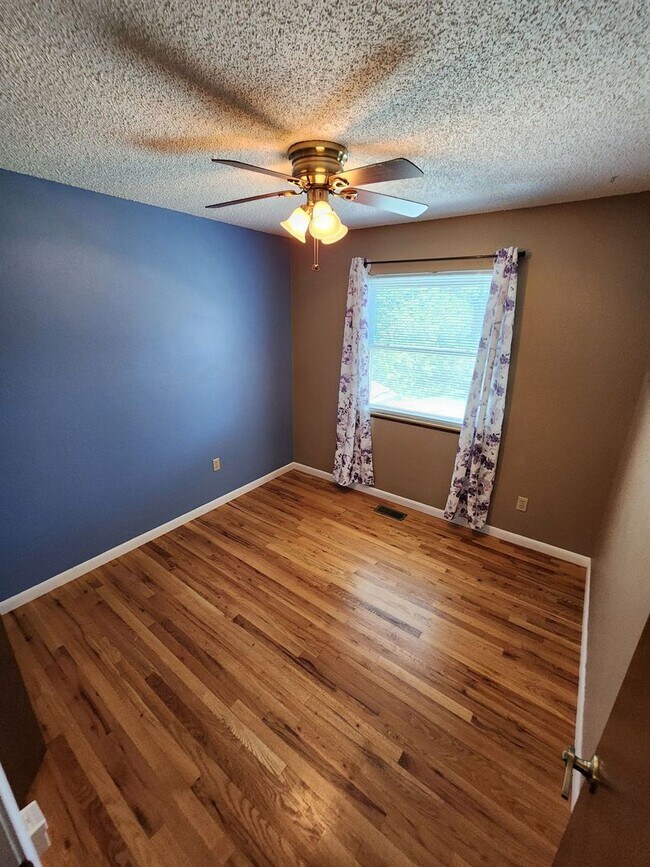 Building Photo - Spacious 4-Bedroom Home with RV Parking in...