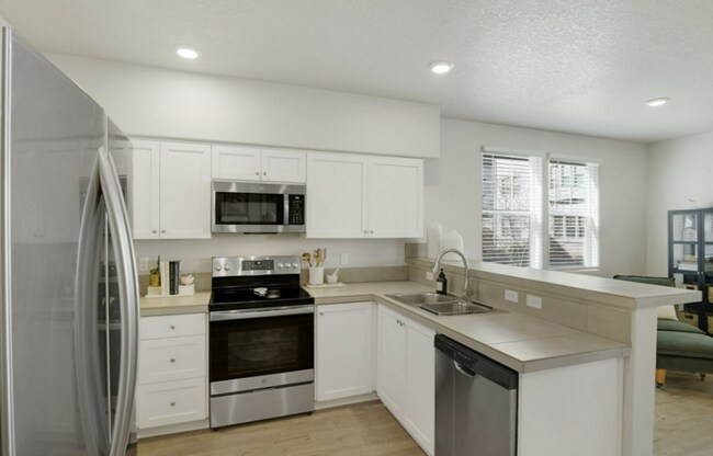 Building Photo - Modern Ground-Level Condo in River Terrace...