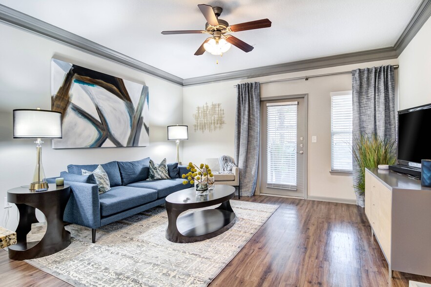 Bright Living Room with Hardwood-Style Flooring - Waterstone at Big Creek Apartments