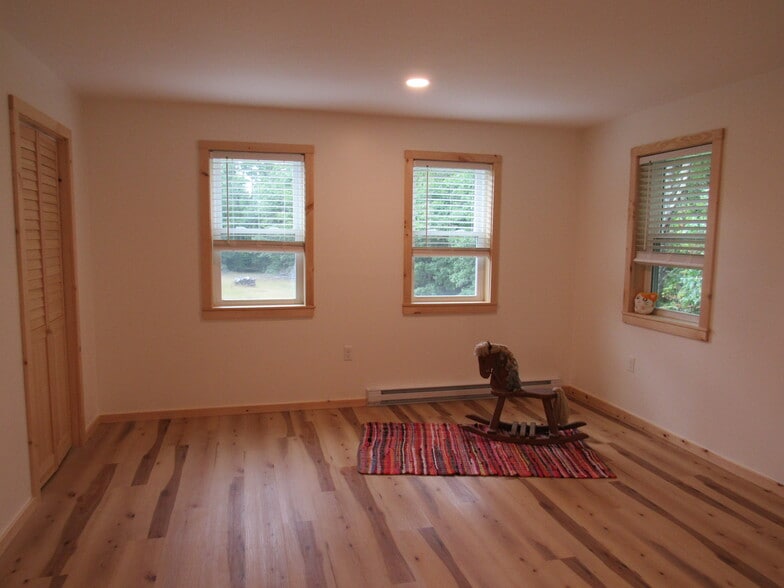 Second bedroom looks out onto the meadow and has 2 closets - 57 River Rd