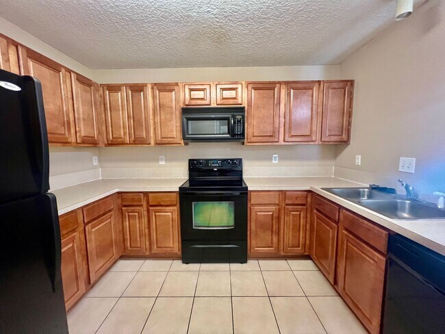 Building Photo - Gated Comfort Condo, Poolside Vibes: Your Next Home Awaits at Merrill Pines