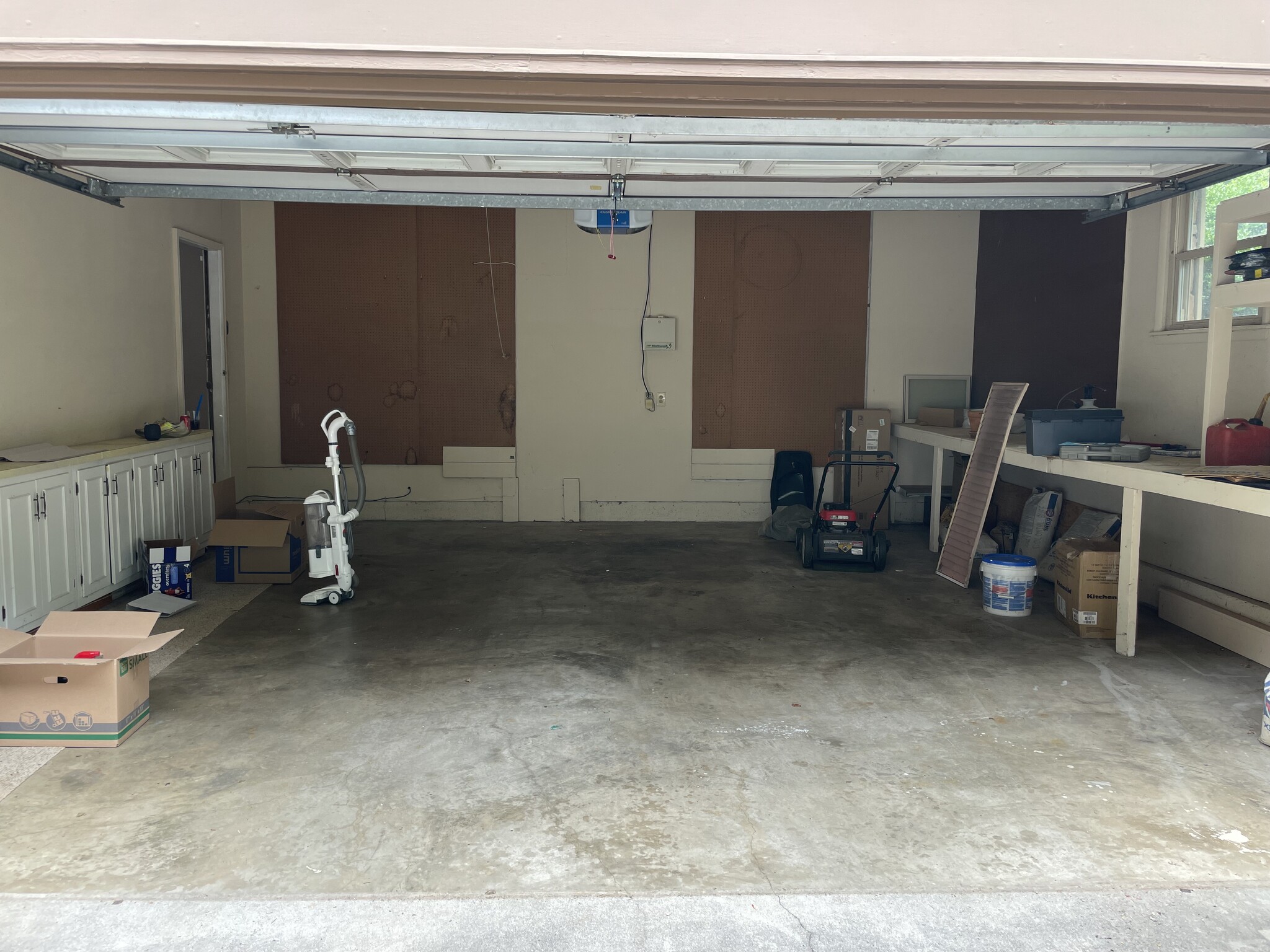 Garage with plenty of storage and fridge (not pictured) - 8205 Ainsworth Dr