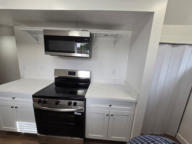 Building Photo - Remodeled 4 Bed, 2 Bath with Double Kitchen & Covered Carport