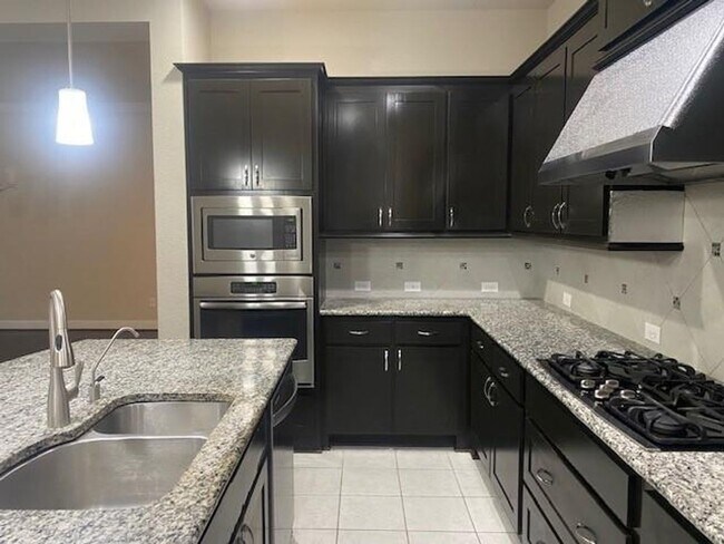 Building Photo - Breathtaking 4-bedroom home in the highly ...