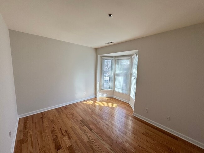 Building Photo - Top-Floor End Unit Condo at New Bern Place