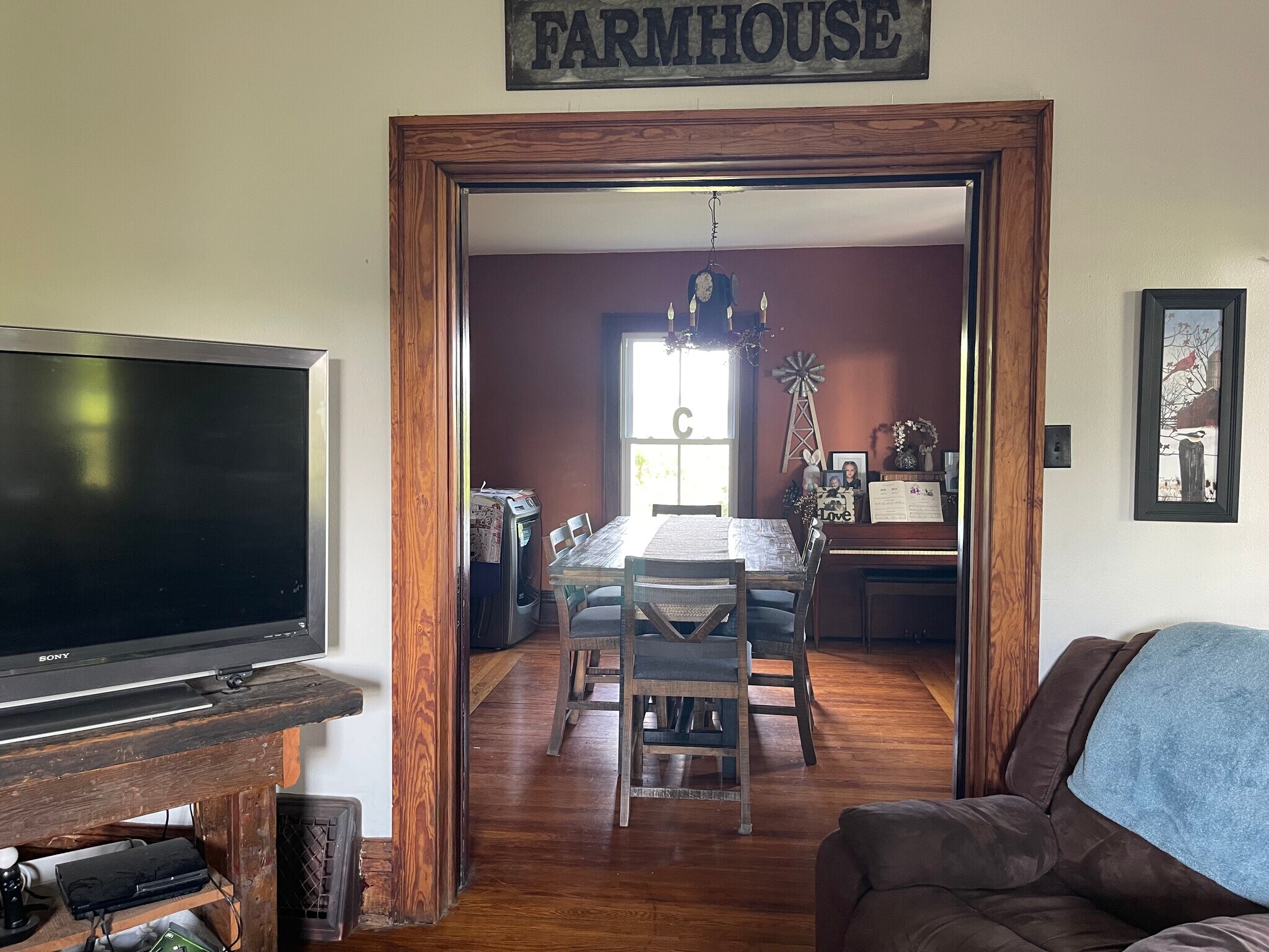Looking into the dining room from the living room through the original pocket doors - W5198 Advance Rd