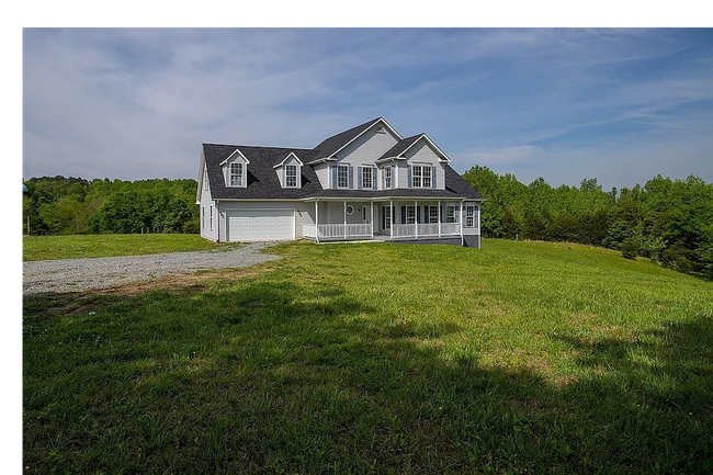 Primary Photo - 4-Bedroom Home on 12 Acres with 2 Car Atta...