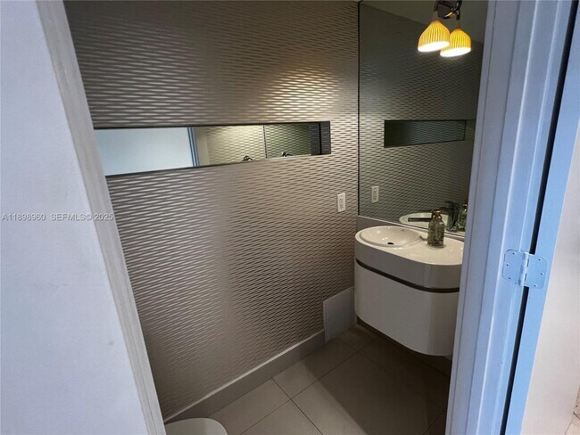 Building Photo - 18671 Collins Ave