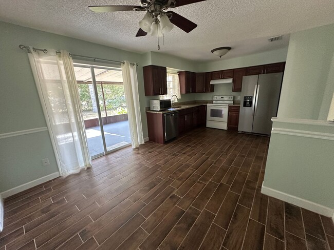 Building Photo - Unique Find! HUGE detached garage/workshop, 3 bedroom, 1 1/2 bath home, screened porch