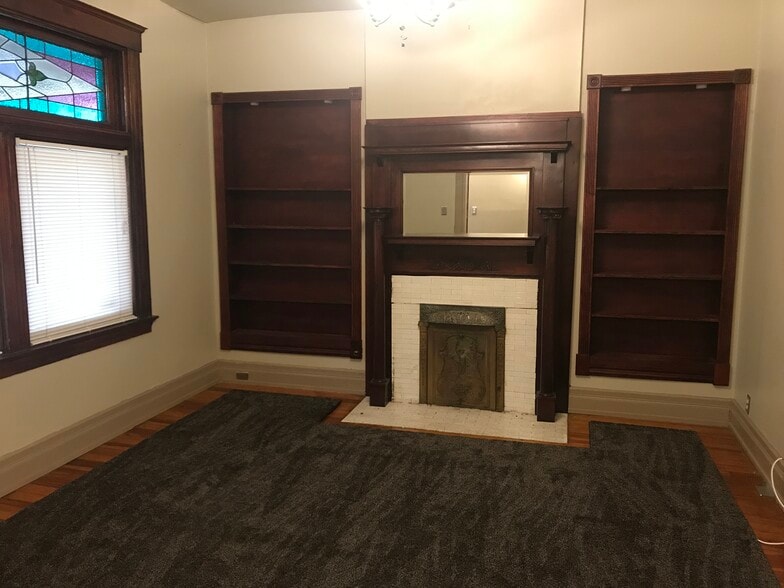 Living Room w/ built in bookcases & pocket doors (opposite wall) - 418 Garrard St