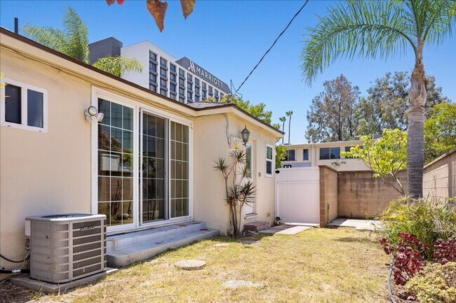 Building Photo - Corner lot home on a classic tree lined Beverly Hills street