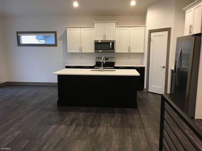 Building Photo - Spacious 4 bedroom/3 bath home with finished lower level and attached 2 car garage