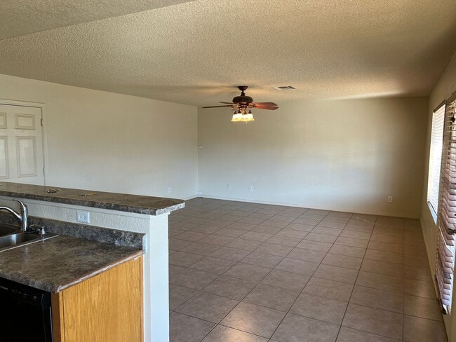 Building Photo - Four Bedroom Mountain View Home with large fenced back yard and double gates