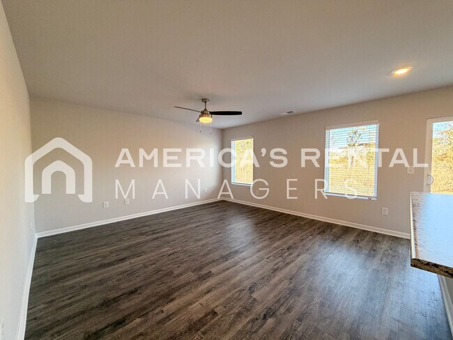 Building Photo - Spacious Two-Story Townhome with Open Layout!