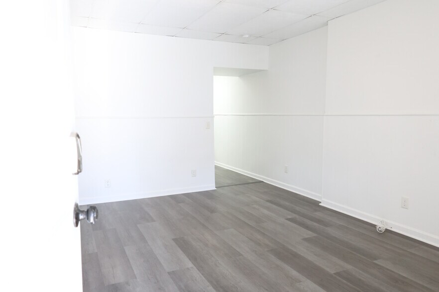 New Flooring: High-end Luxury Vinyl Plank (LVP) throughout the entire home. - 9104 Baltimore St