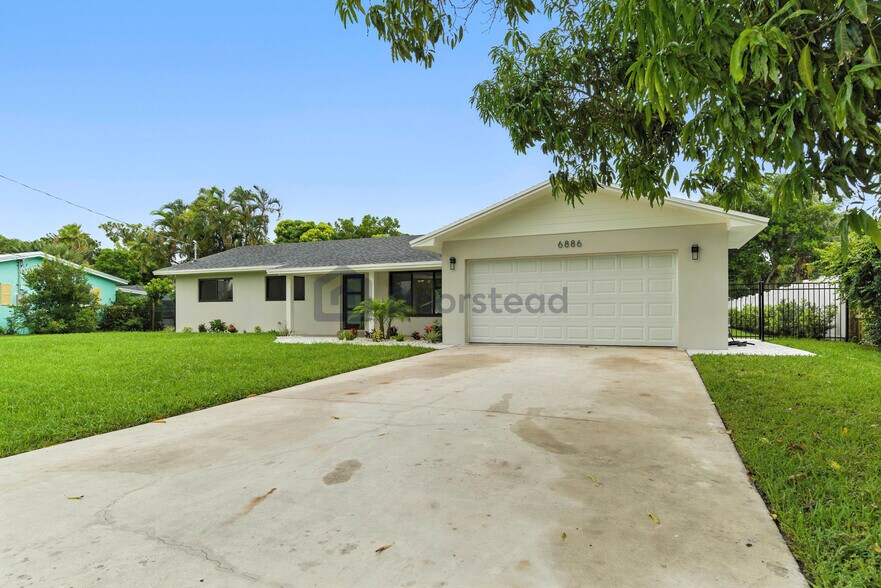 Building Photo - 6886 Tradewind Way