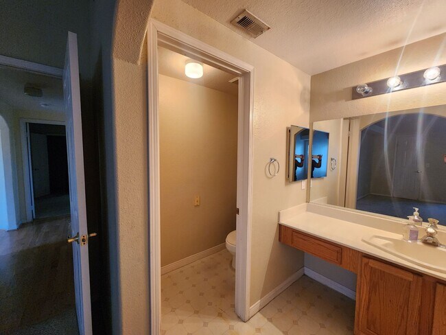 Building Photo - 2nd Story Condo in gated community close to the pool.