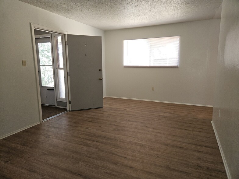 Living room, toward entry. - 544 Chama St SE
