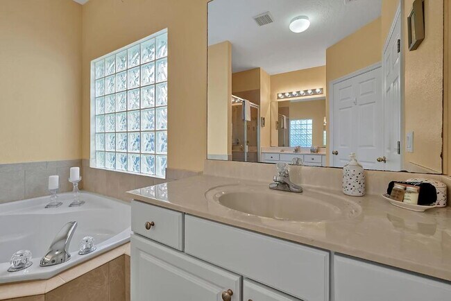Building Photo - "Stunning 3BR Orlando Home with Private Screened Pool, Spa & Spacious Living Areas"