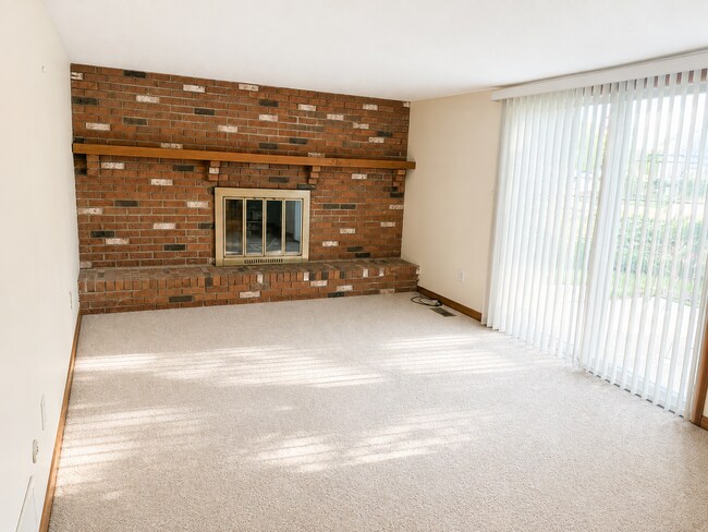 Building Photo - Spacious 3-Bedroom Split-Level with Formal Dining Room, Fireplace, and Fenced Backyard