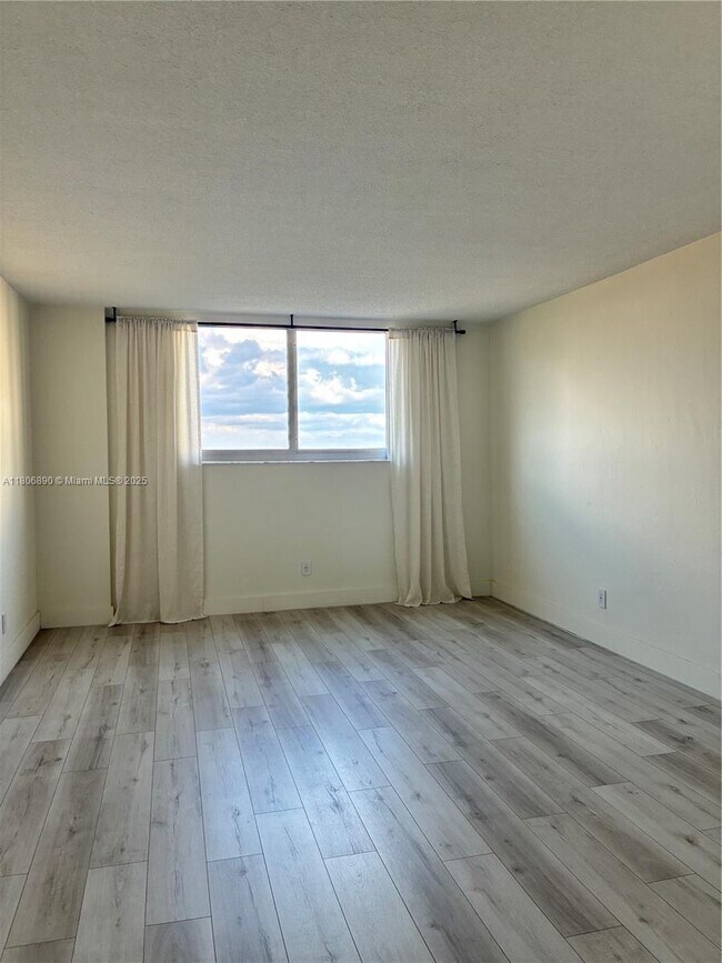 Building Photo - 19380 Collins Ave