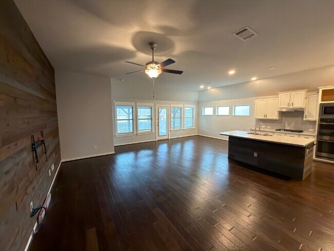 Building Photo - Four bed two bath on a corner lot with a pool in Sunfield. Gas cook top, double ovens. Open kitch...