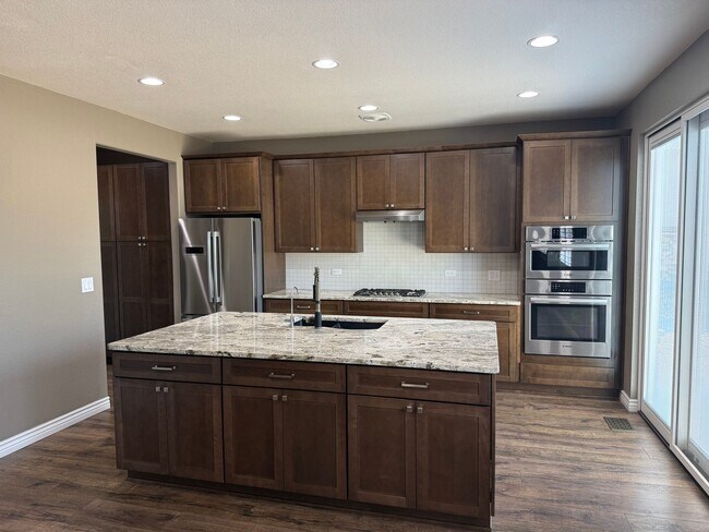 Building Photo - Greenbelt-Backed Wheatlands Home - Mountain Views, 3 Car Garage & Finished Basement