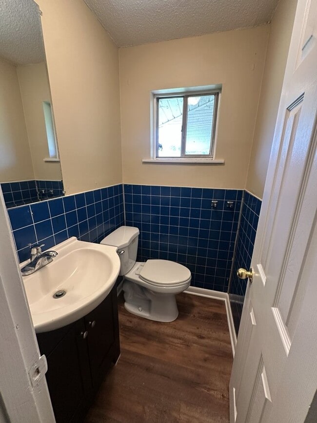 Building Photo - Bright 4BR Home with Fenced Yard, Hardwood Floors & Garage on Rankin St