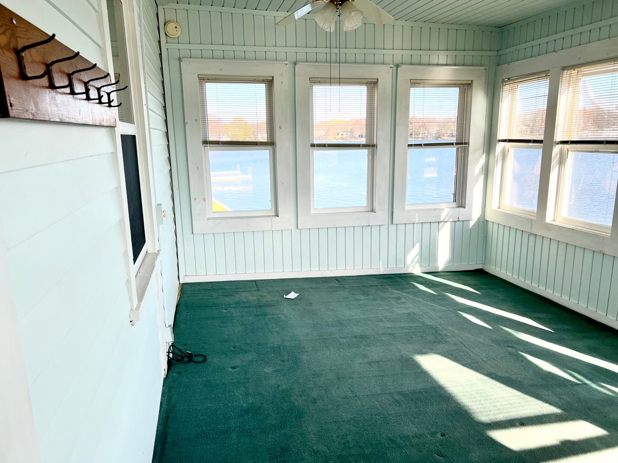 Three seasons room with panoramic view of the lake. - 319 N Lake Rd