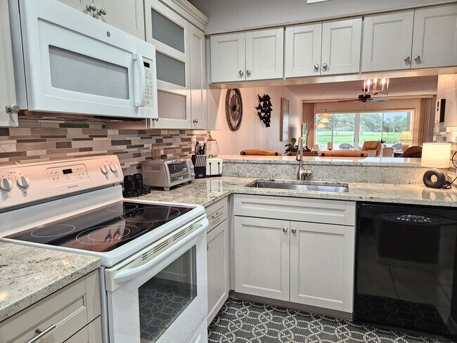 Building Photo - Charming First-Floor Condo in Plantation Golf and Country Club with a Community Pool Access!