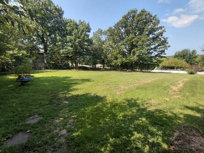 Building Photo - Fenced home close to post!