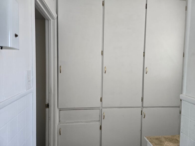 Main bath custom built cabinets with custom built laundry basket - 2863 Colorado Ave